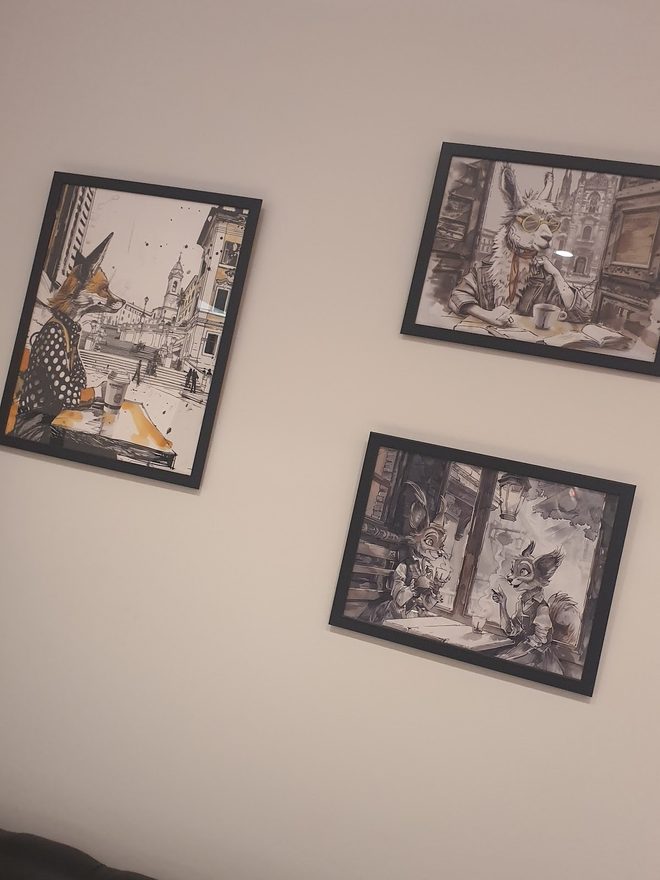 Framed black-and-white Italian prints on the wall